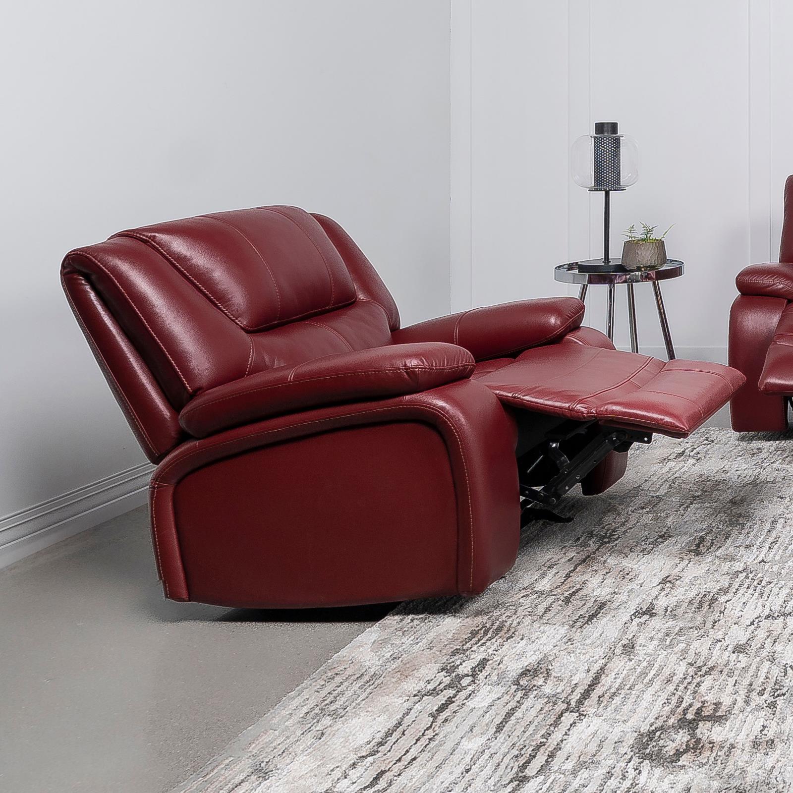 Close-up of red faux leather upholstery and manual recline lever