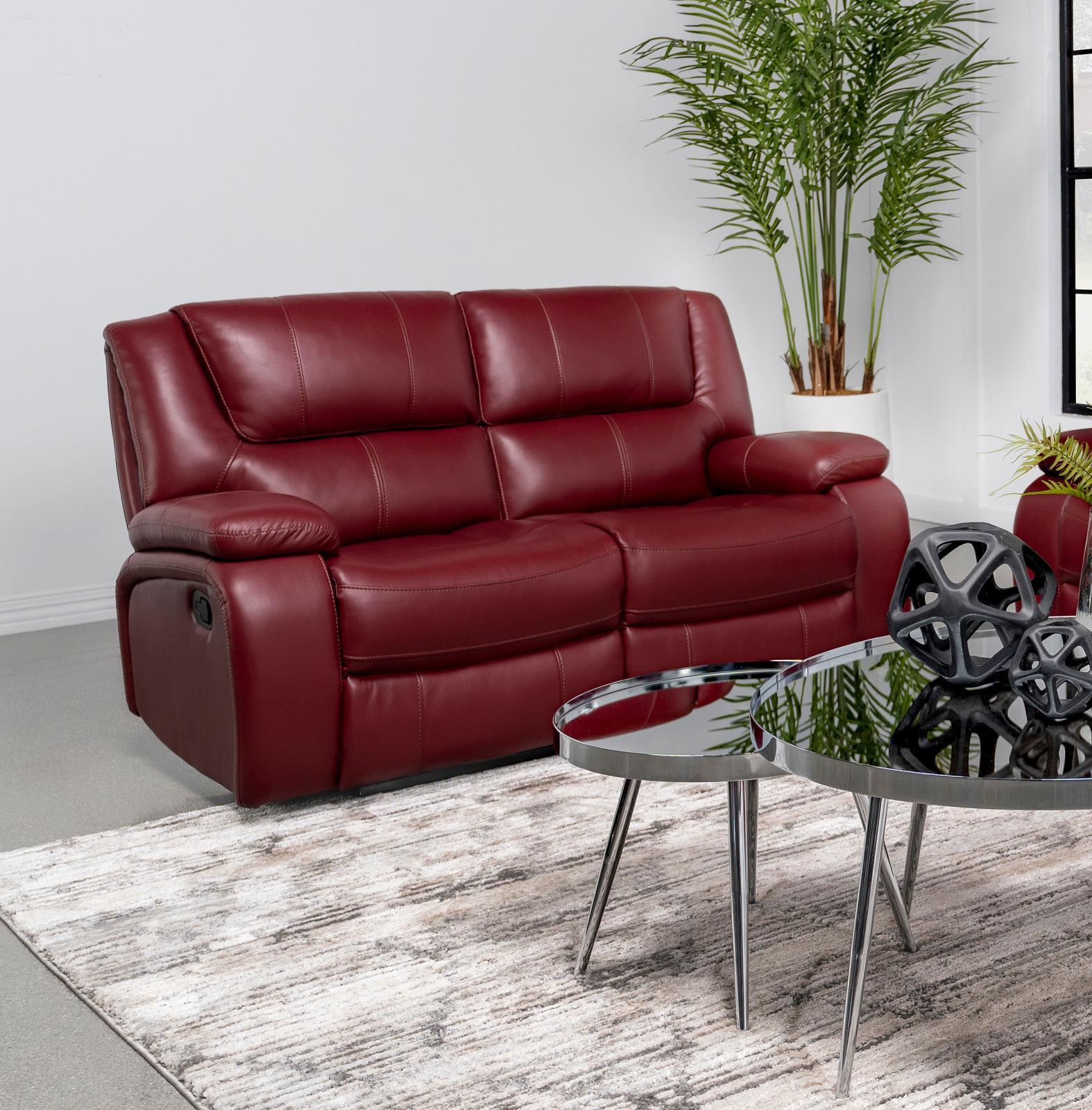 Camila loveseat showing manual recliner button on side