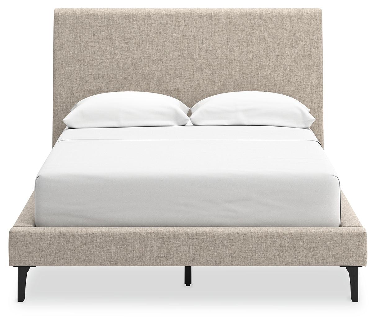 Footboard detail of Cielden Full Upholstered Bed in soft gray