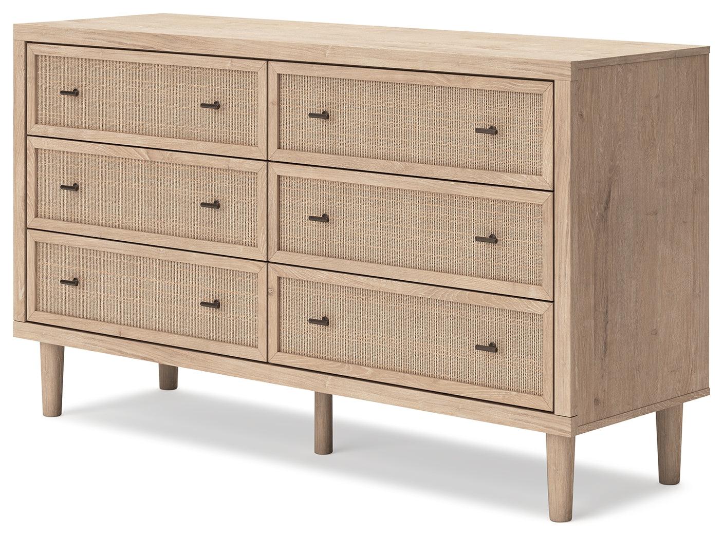 Textured beige cane-look drawer fronts of Cielden dresser