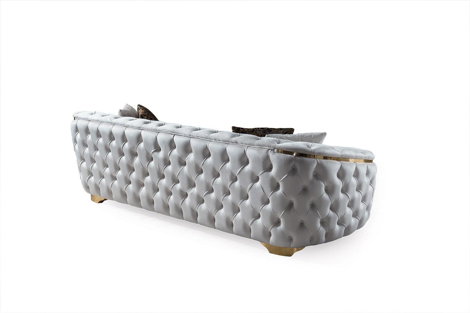 Side angle of loveseat showcasing elegant ivory velvet