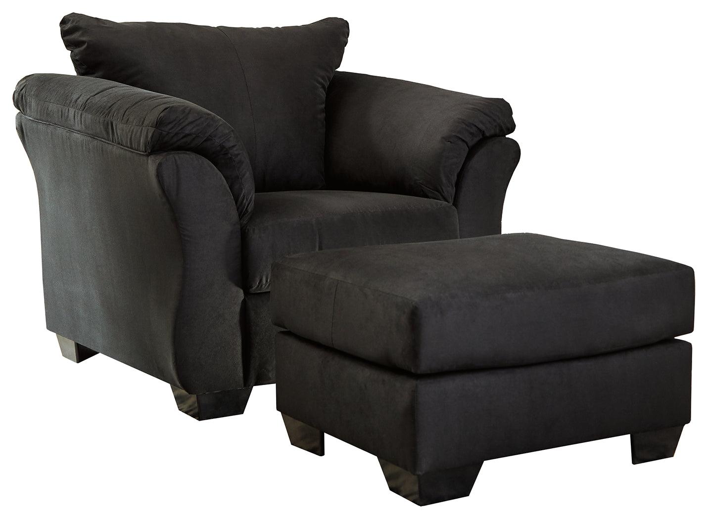 Side view of Darcy black chair with pillow top armrests