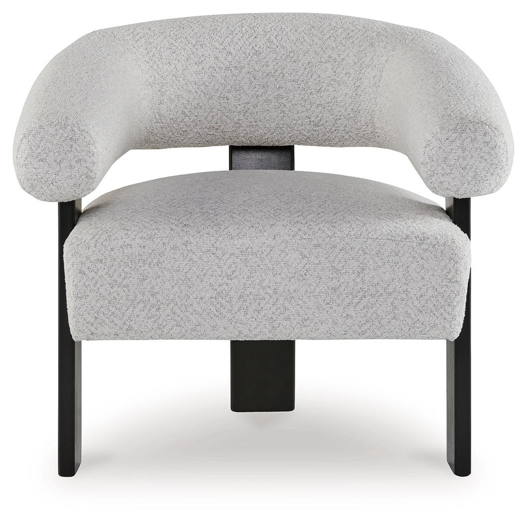 Close-up of textured snow-colored polyester upholstery on accent chair