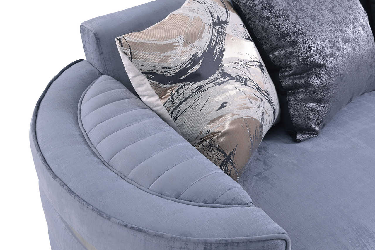 Side angle showing sofa arm and velvet texture