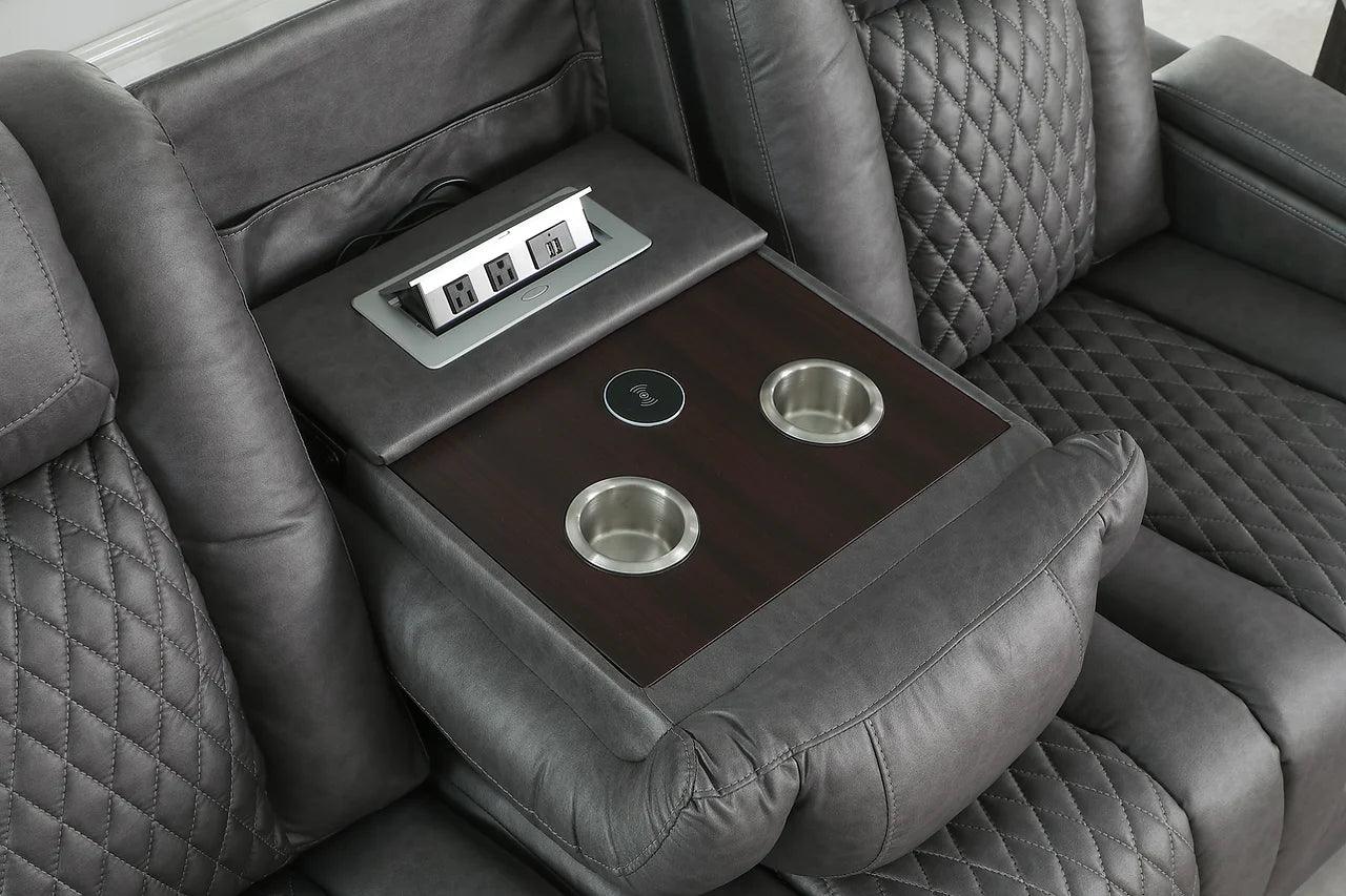 Drop-down table between loveseat seats in power reclining set