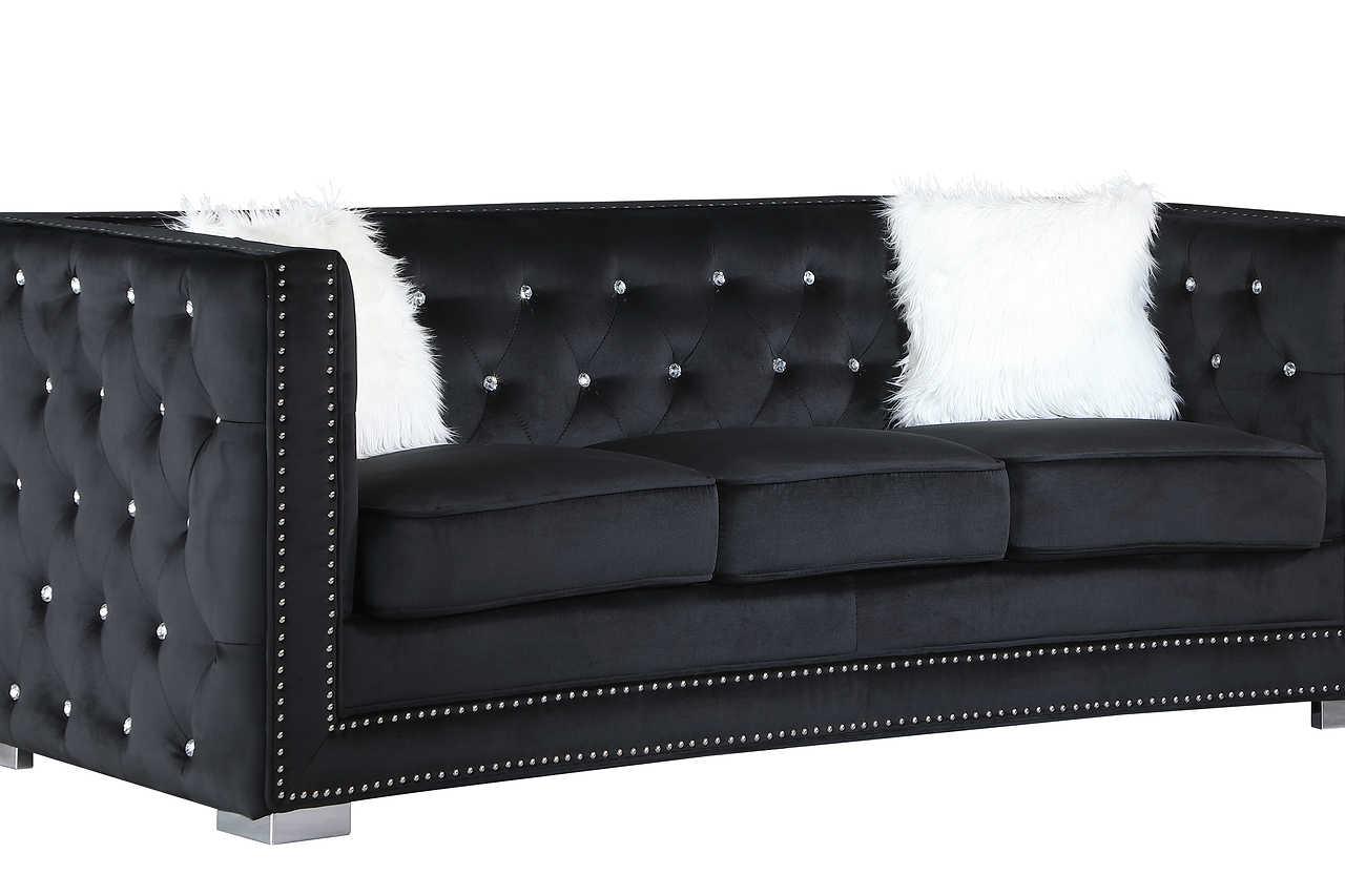Close-up of tufted black velvet upholstery on Paris set