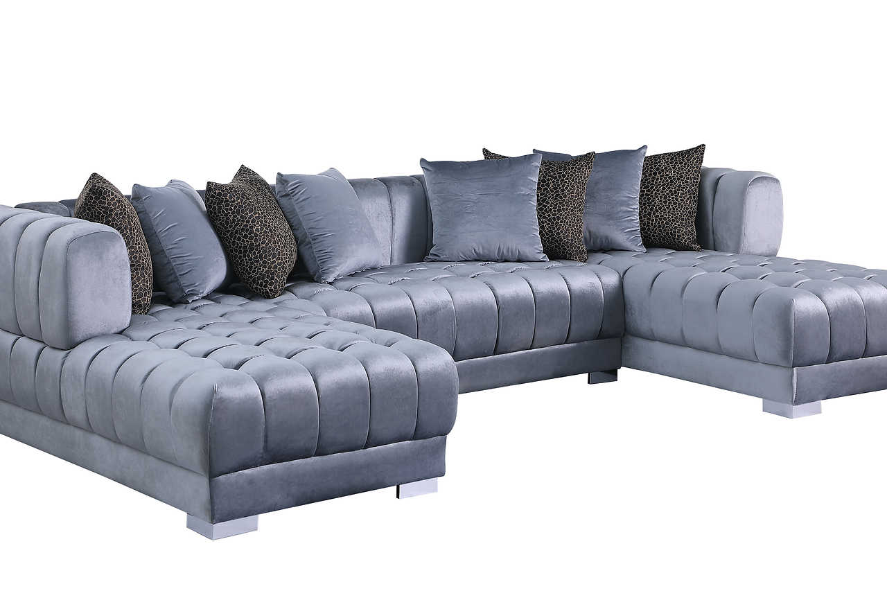 Detail of gold legs and velvet fabric on Dasha Grey sectional sofa