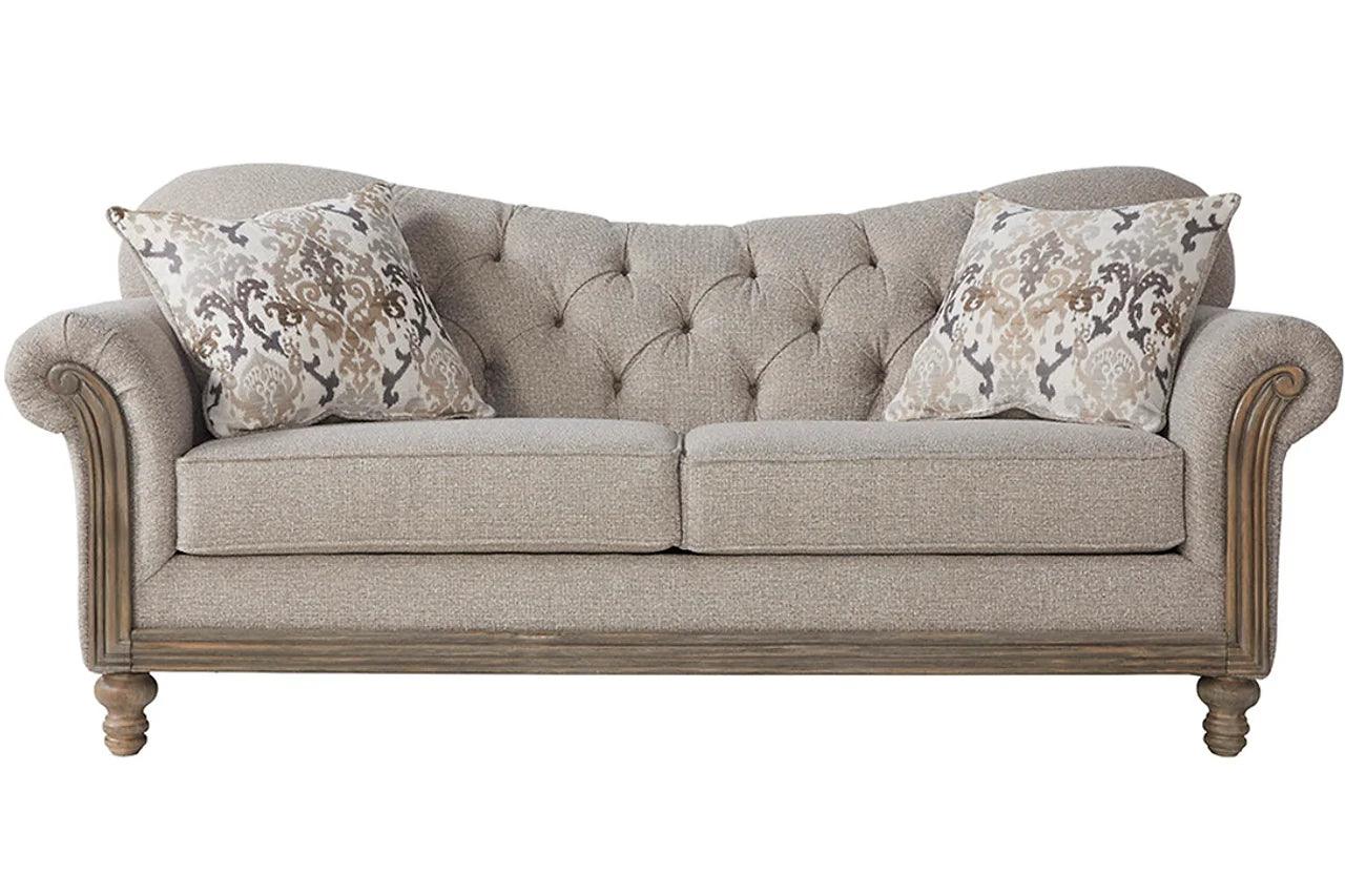 Side angle of beige fabric tufted loveseat
