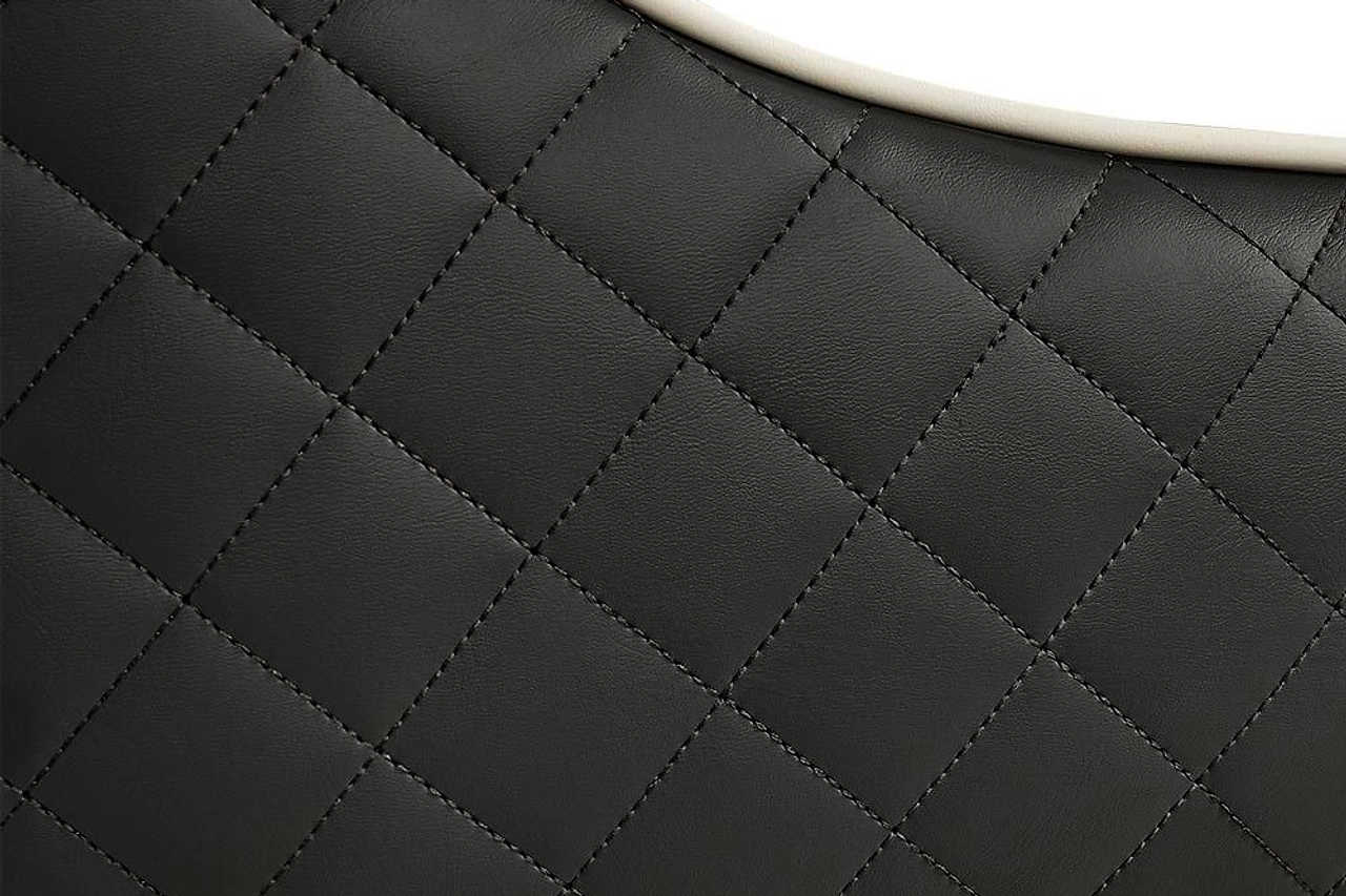 Rani Black Dining Chair angled view with solid wood legs