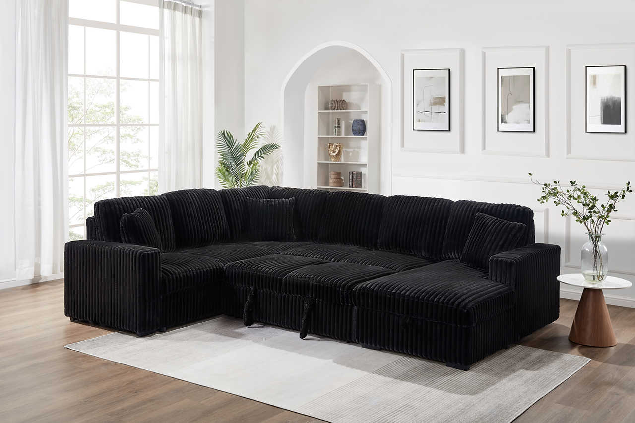 Side angle showing chaise and USB ports on Raha Black Sectional
