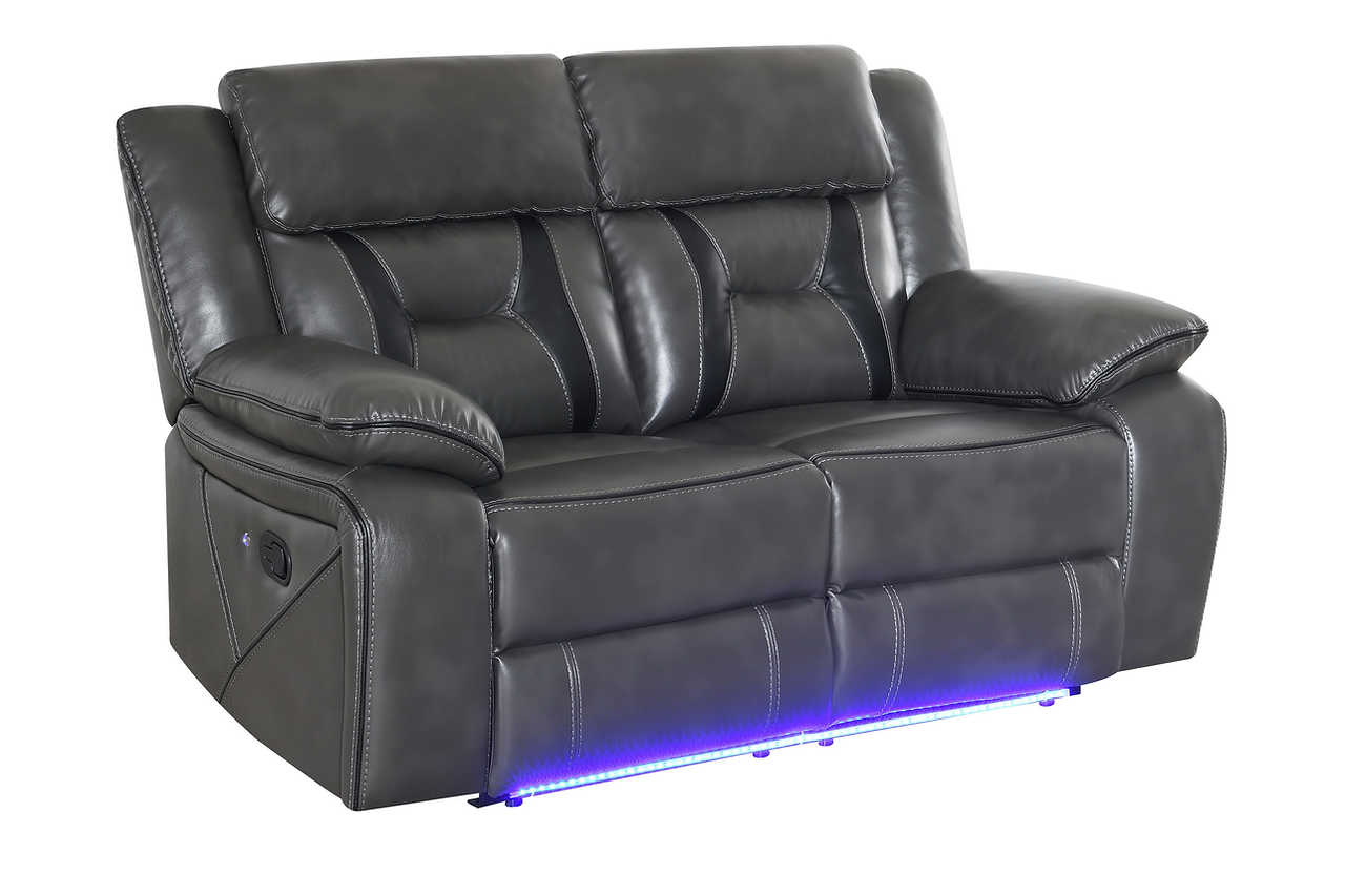 Drop-down table on reclining sofa in light grey