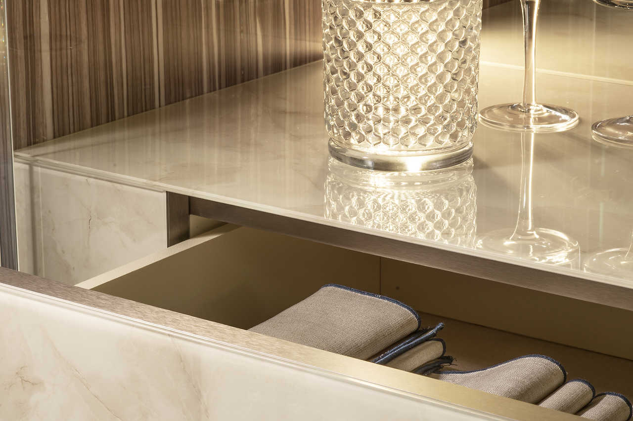 Close-up of champagne satin-finished metal feet on Luce Collection furniture