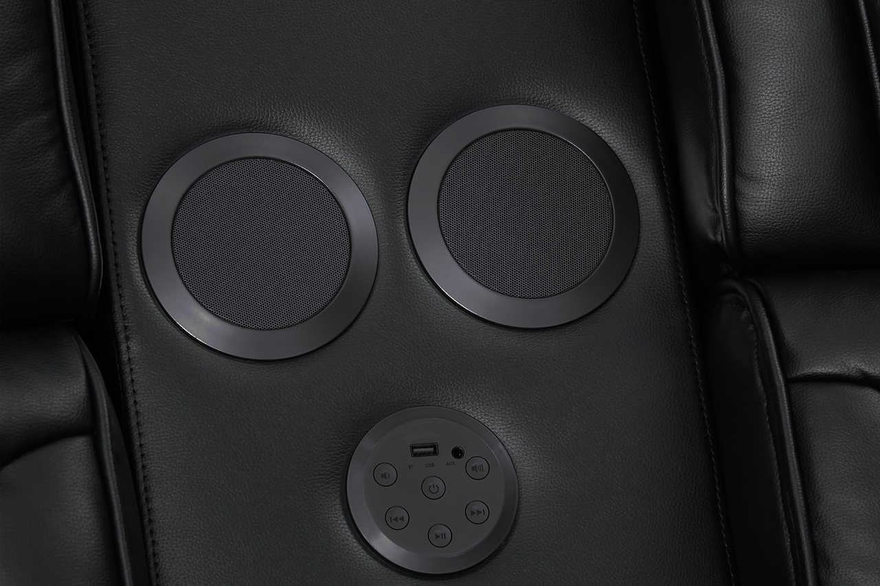 Side view of Skyline power reclining sofa showing wireless charger and USB ports