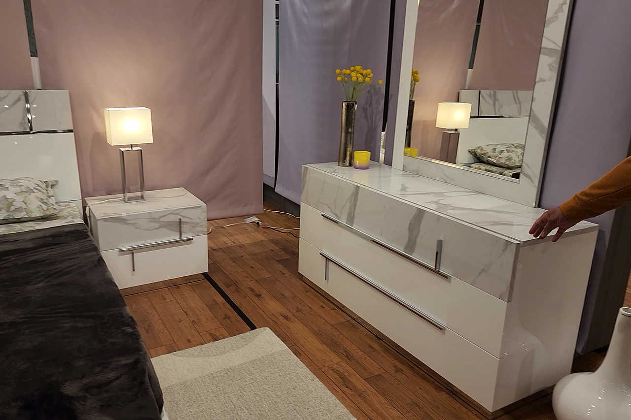 Full view of white high gloss nightstand with drawer open