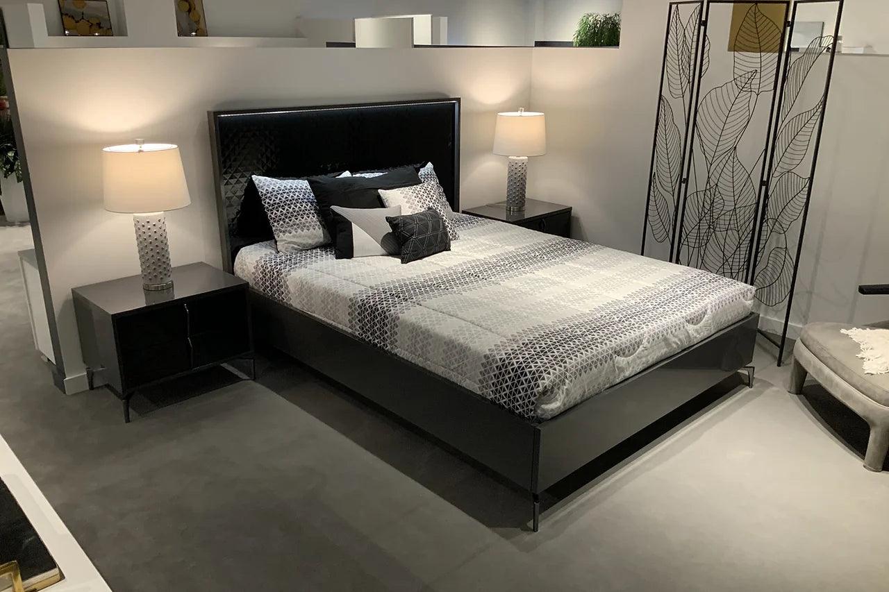 side view of Osiris Black Gray LED Panel Bedroom Set bed showing rose gold metal legs