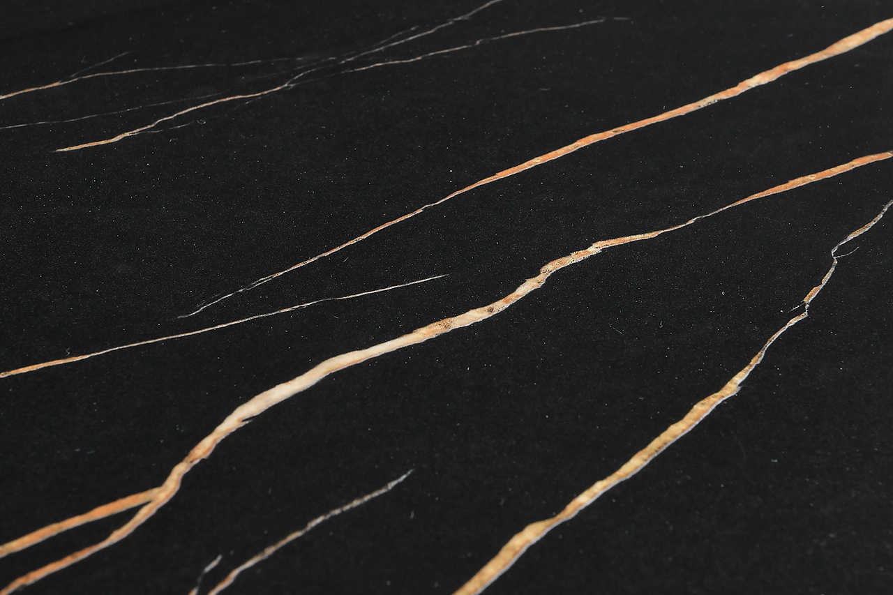 Giovanni dining table black and gold marble-effect top, side angle