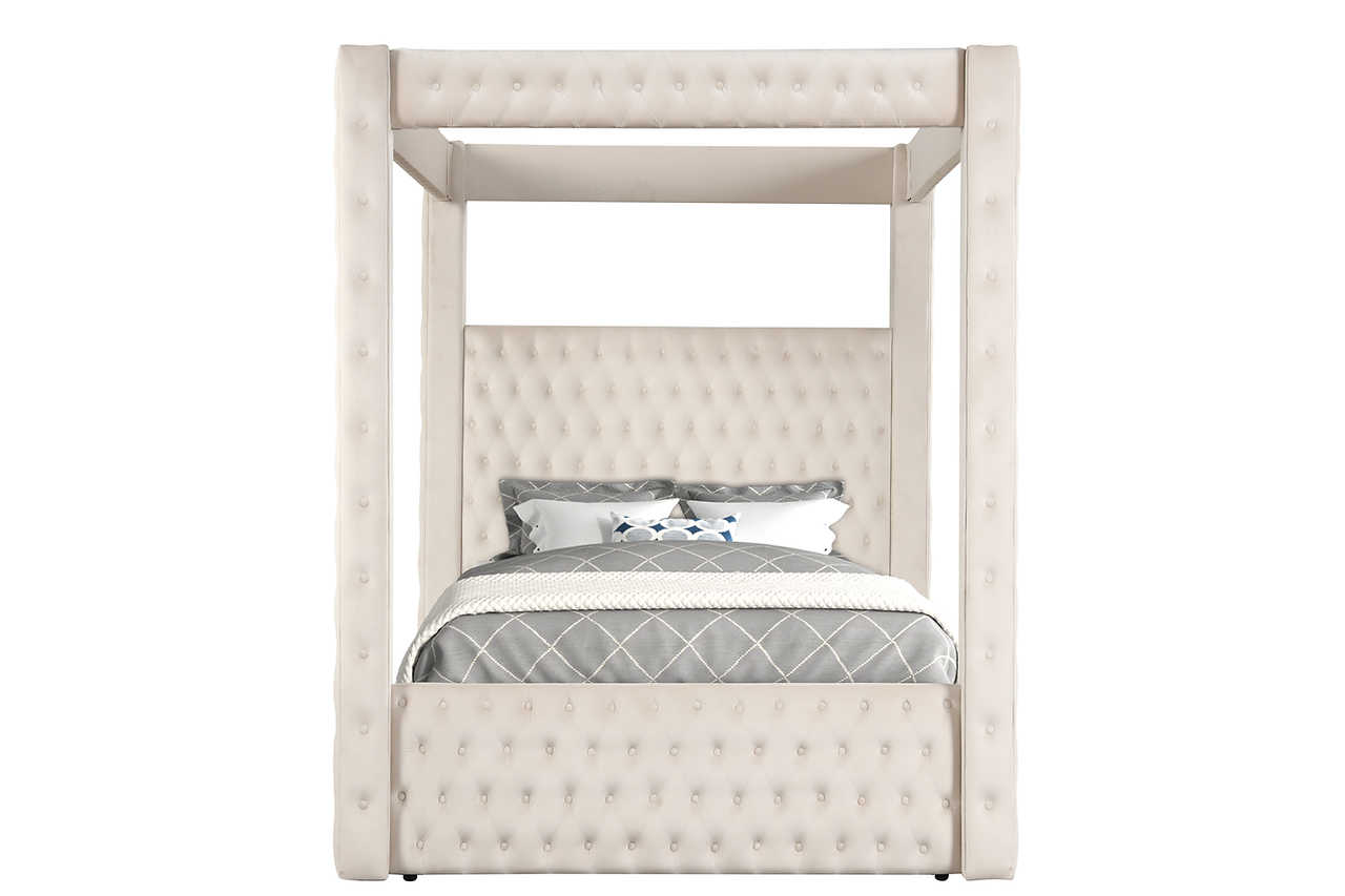 Close-up of tufted beige upholstery on the canopy bed