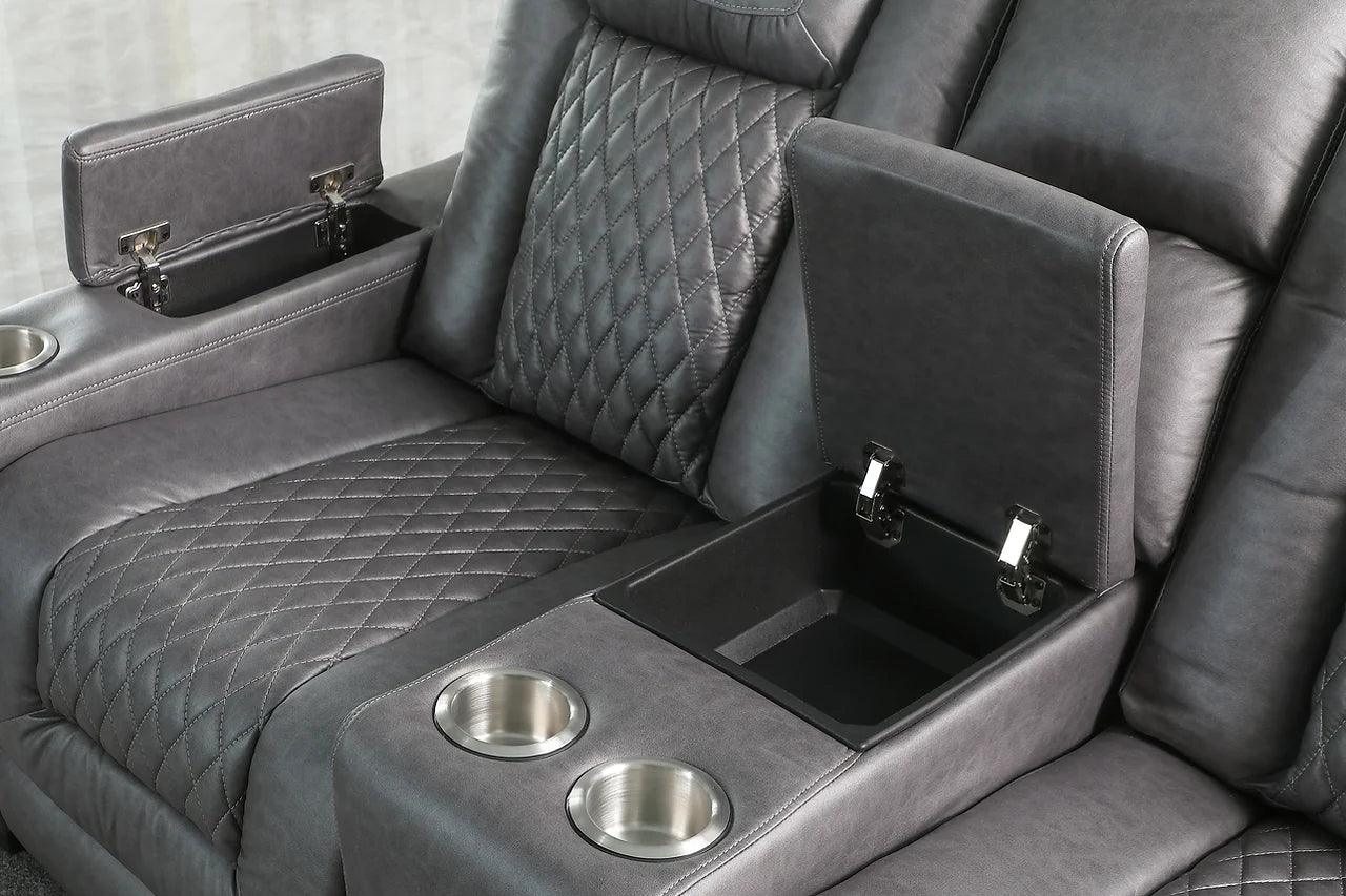 Armrest storage and power controls on reclining sofa