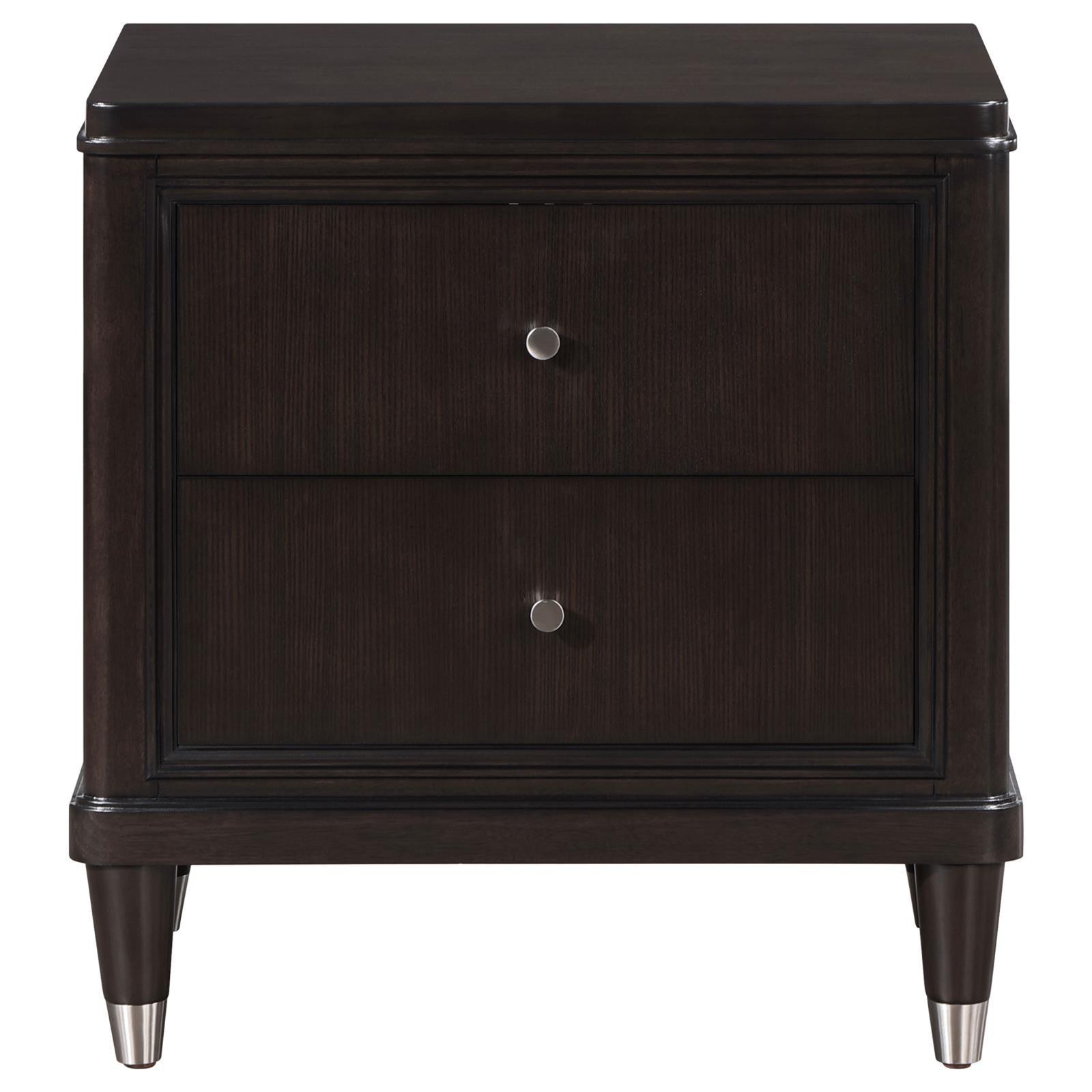 Close-up of Emberlyn nightstand showing tapered feet with metallic caps