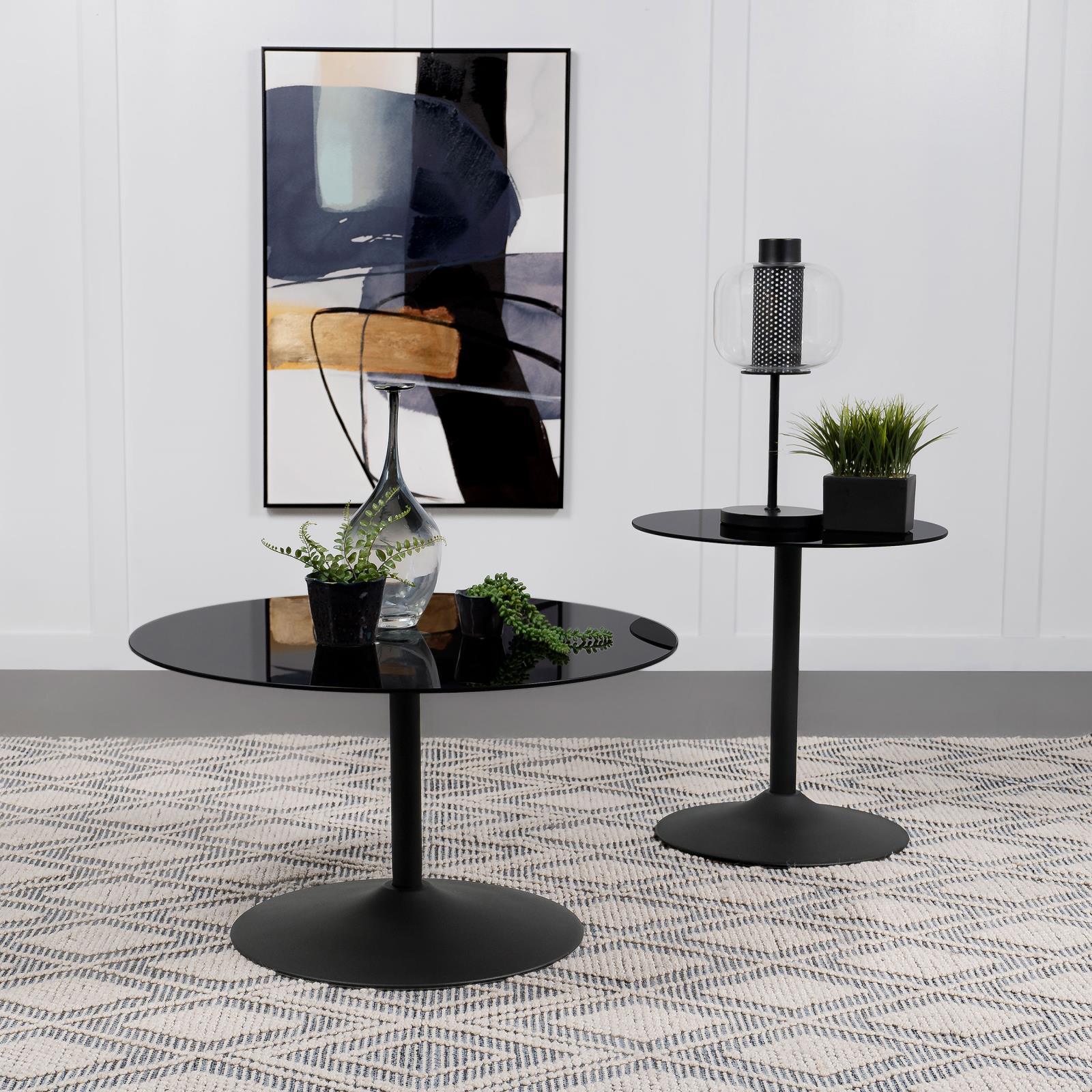 Ganso round black metal end table styled in living room