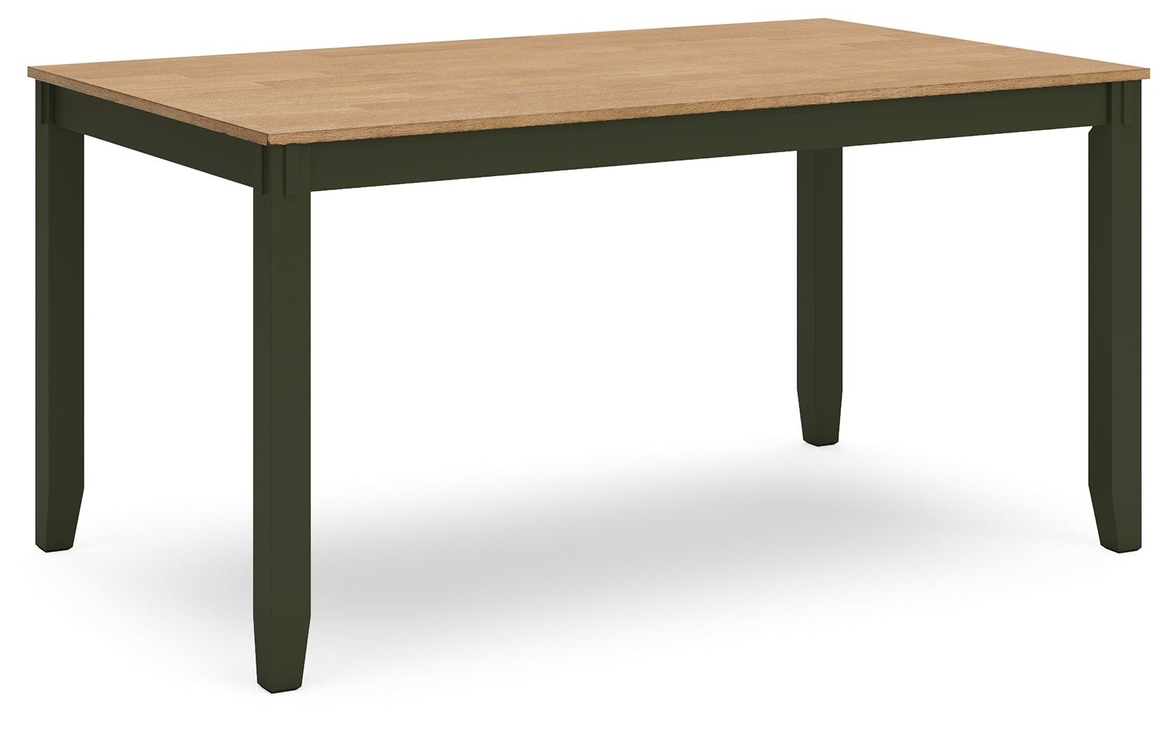 Four solid wood chairs with contoured mango wood veneer seats around the table