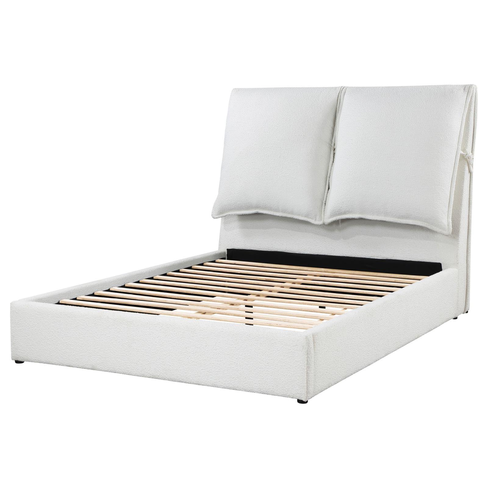 Bed with pillows attached on headboard