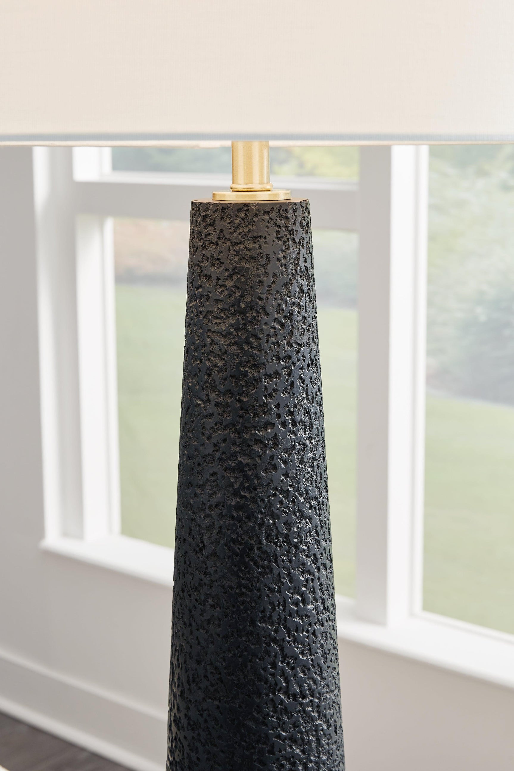 Hallburg Black Floor Lamp illuminated in contemporary room setting