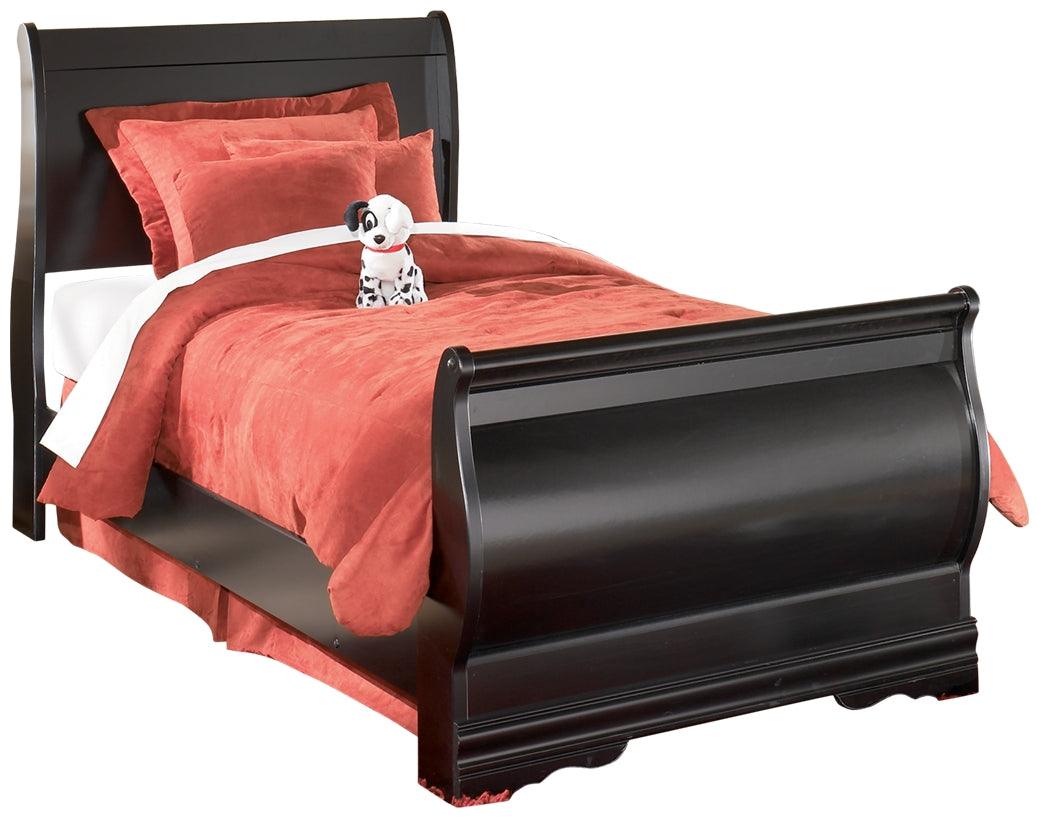 Side view highlighting bed’s sleigh curves