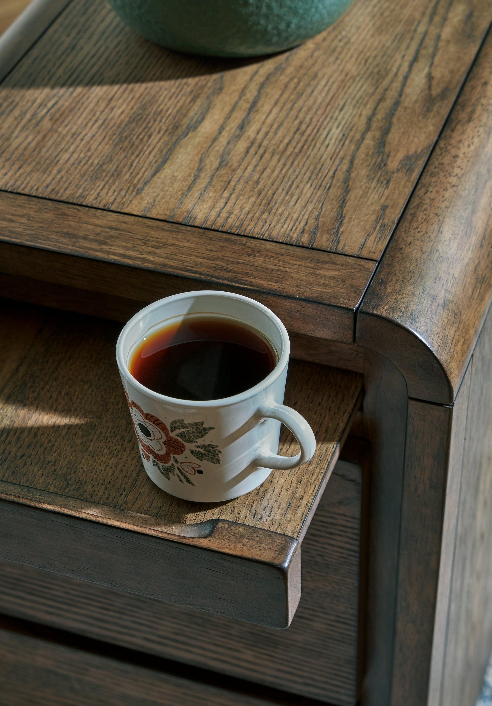 Jensworth Brown Accent Table curved edge detail
