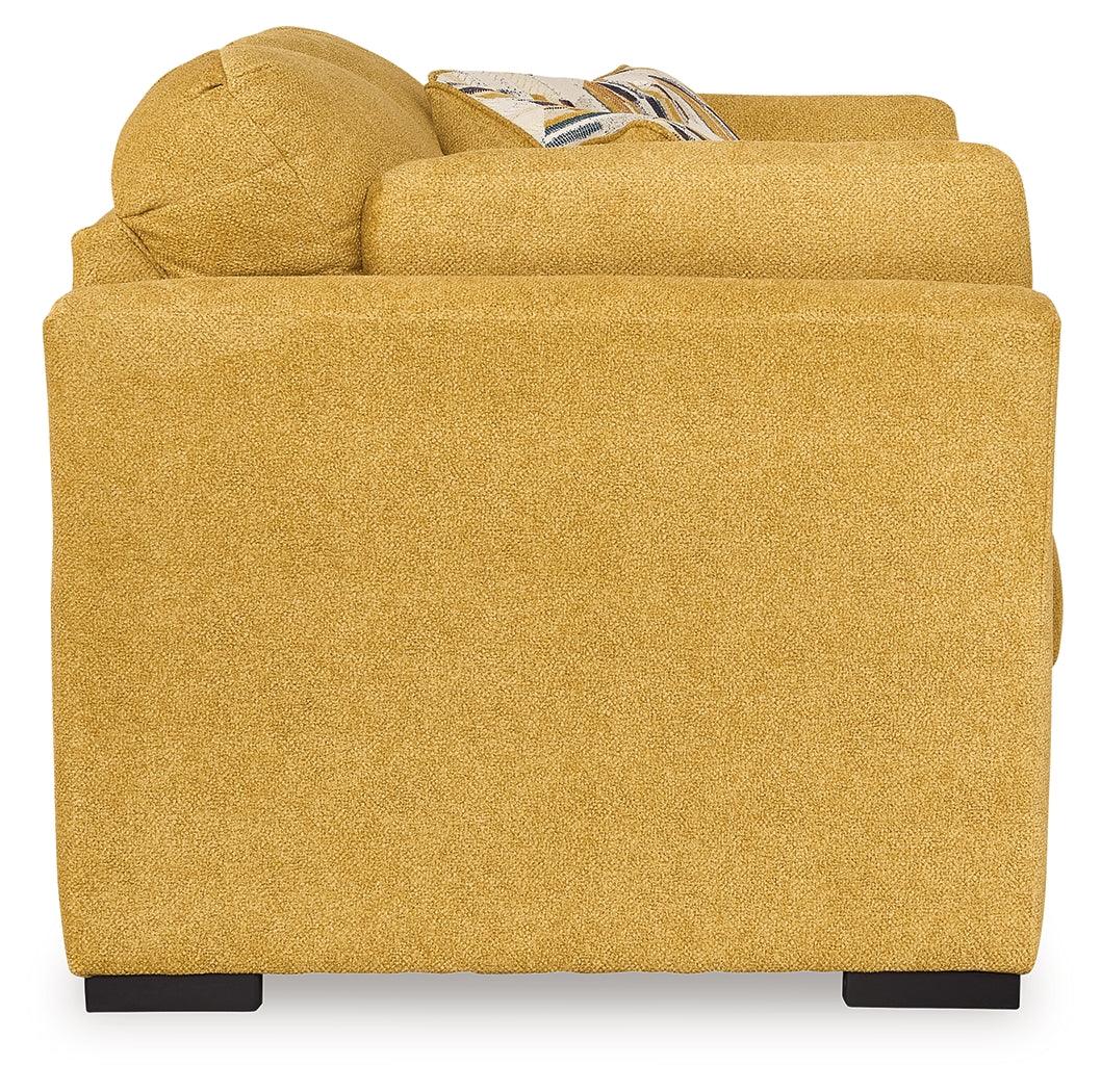 Detailed view of accent and bolster pillows on Keerwick loveseat