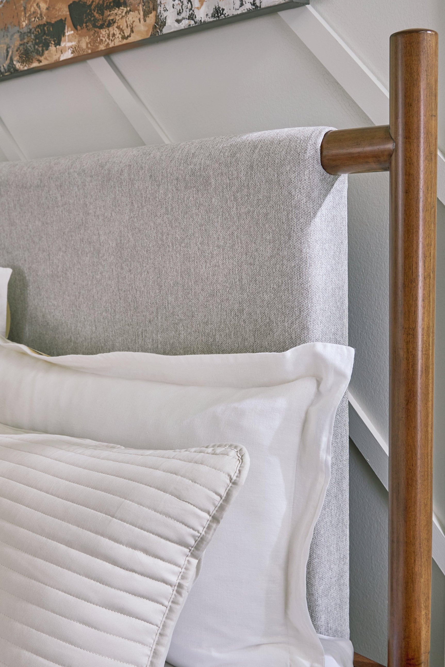 Lyncott Brown Queen Upholstered Panel Bed footboard view