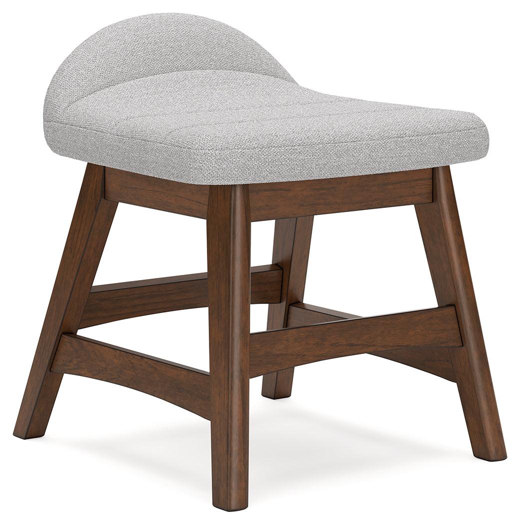 Close-up of light gray upholstery and wood frame