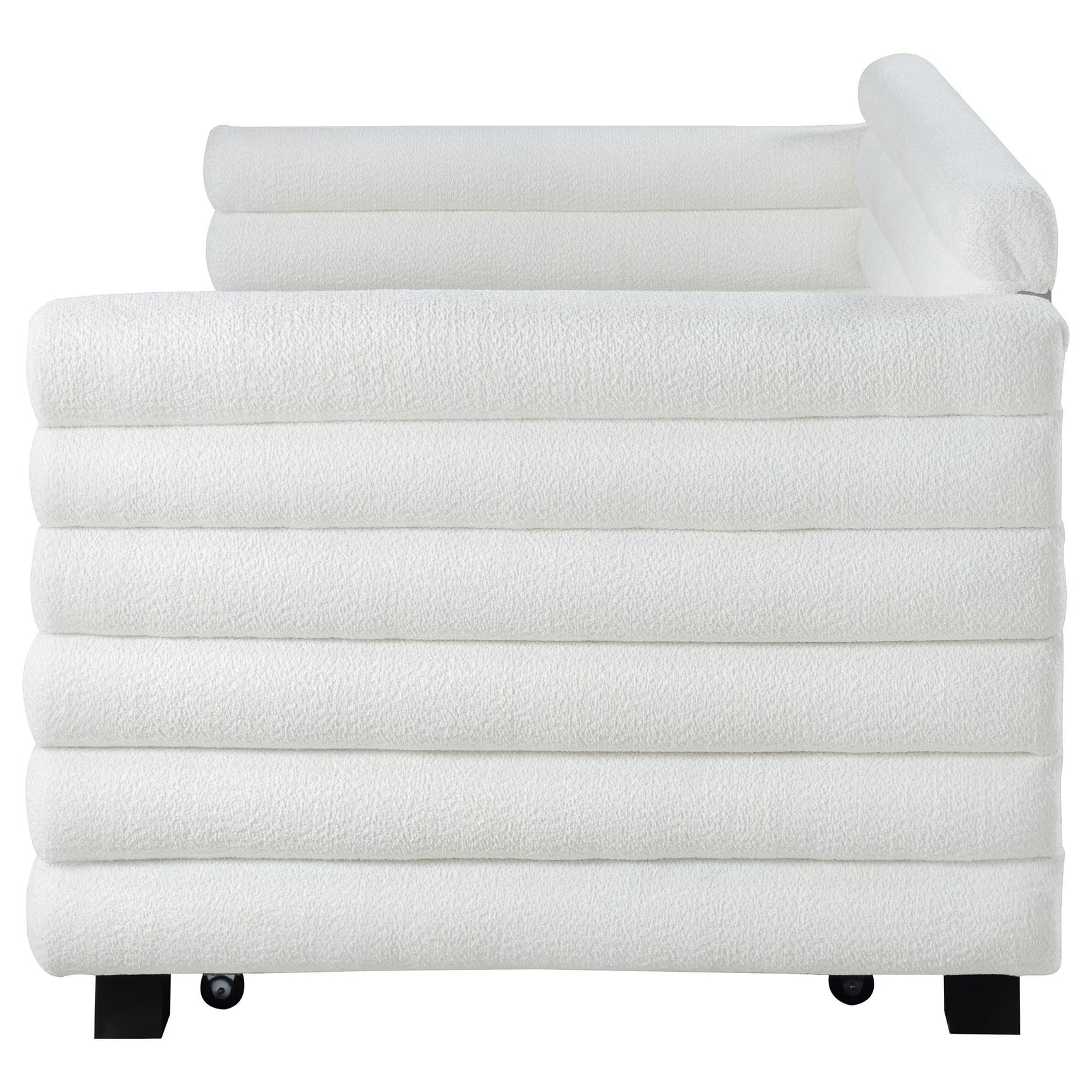 White boucle upholstered twin daybed with trundle, room setting