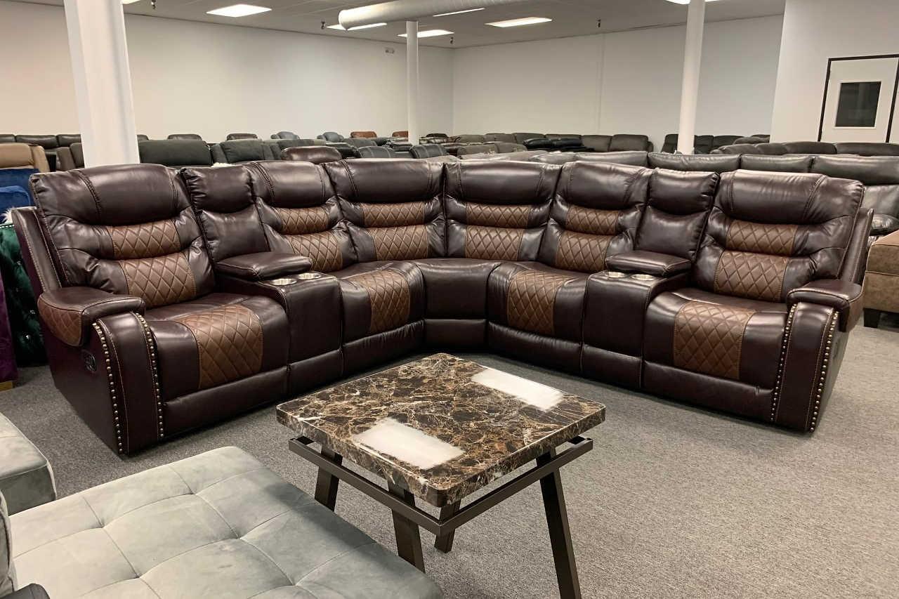 Phoenix brown faux leather reclining sectional sofa side view