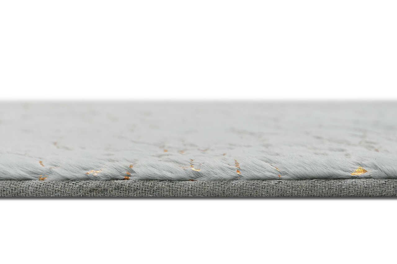 Rabbit Silver Gold rug displayed in modern living room setting