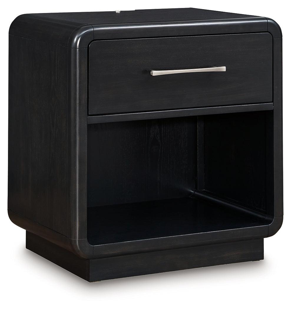 Side angle of Rowanbeck Black Nightstand showing curved silhouette