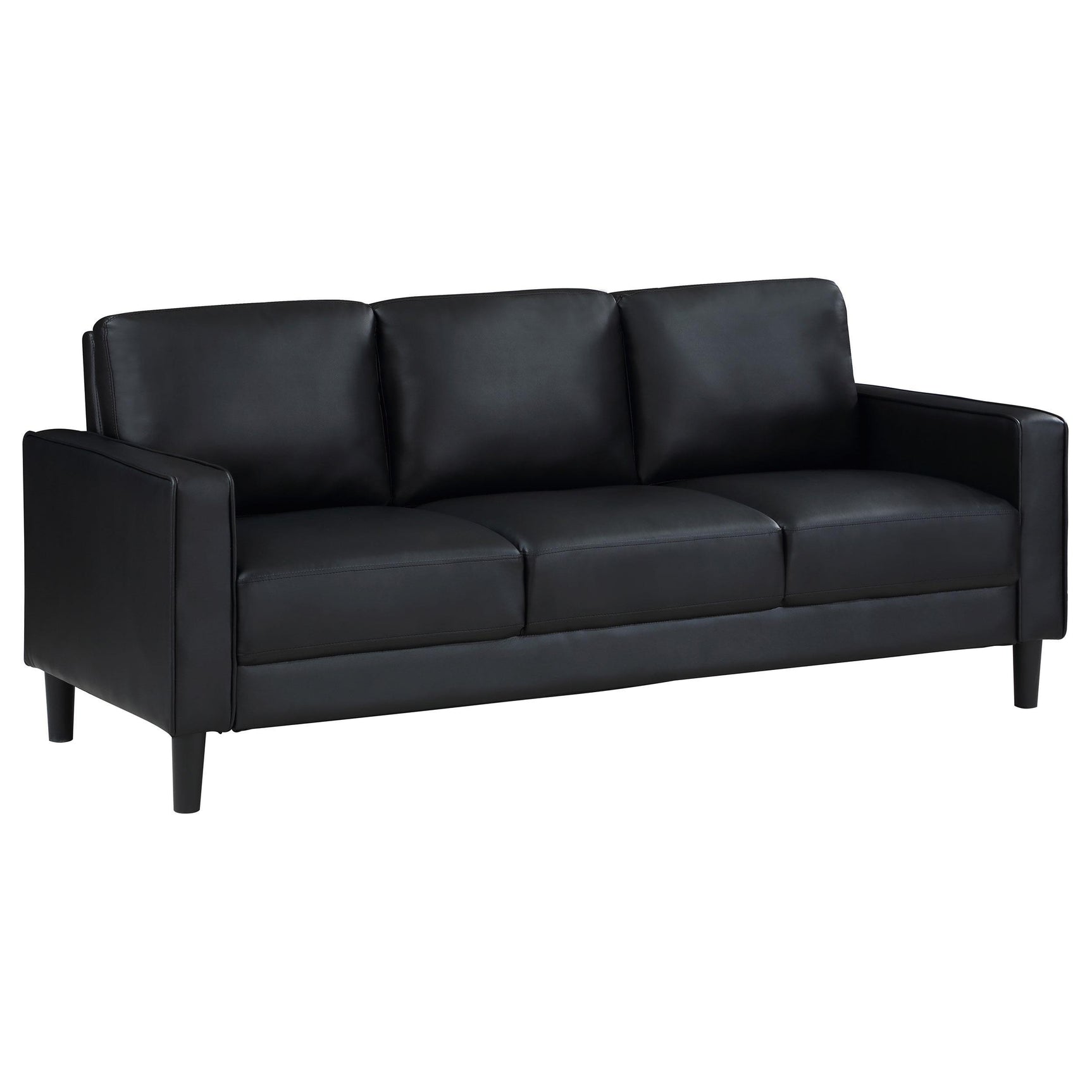 Close-up detail of black faux leather and track arm on sofa