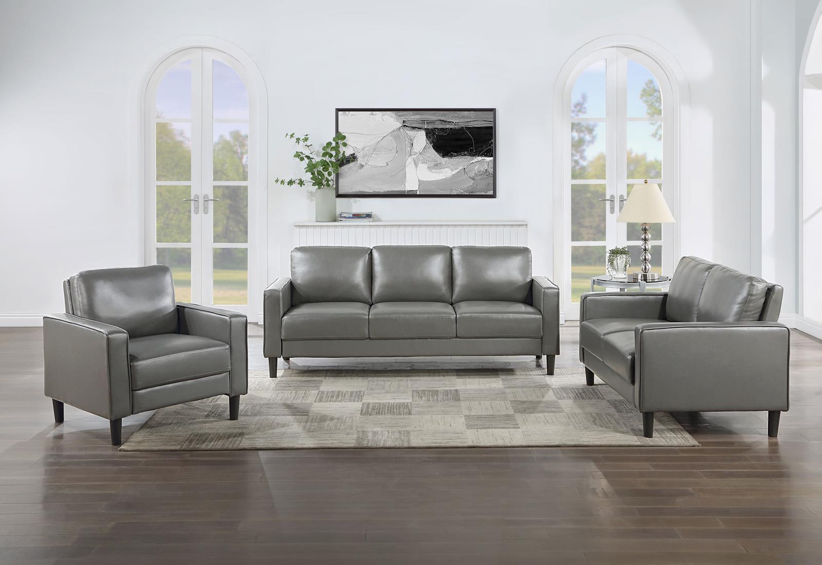 side view of Ruth faux leather upholstered sofa in grey