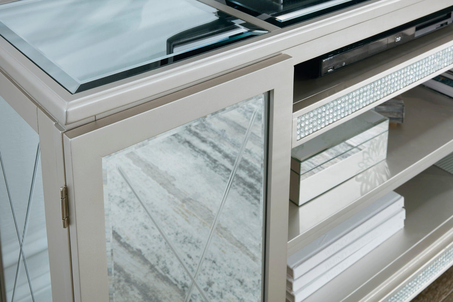 Side angle of Flamory silver modern TV stand with faux crystal and mirror glass doors