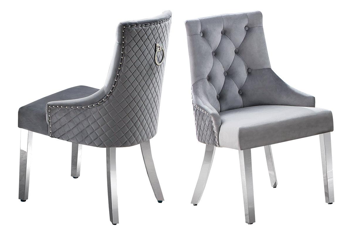 Close-up detail of marble tabletop and chair upholstery in gray
