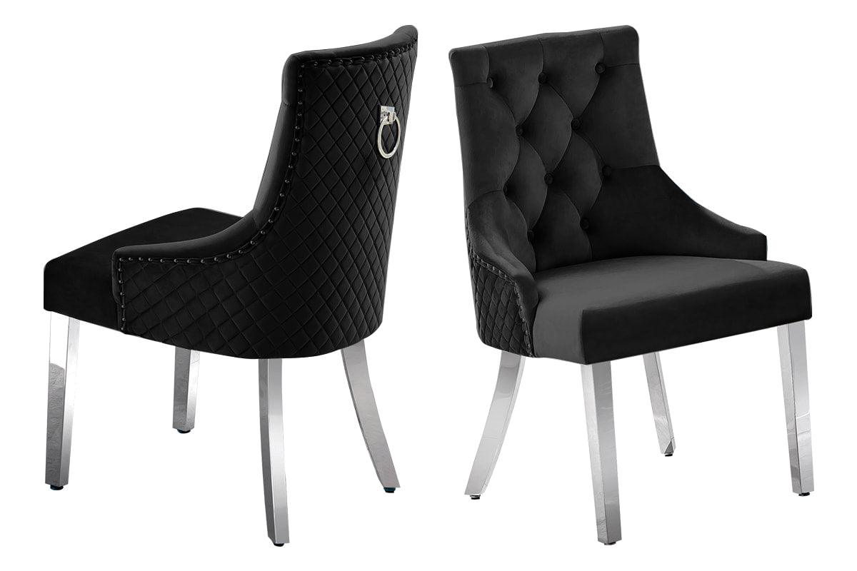 Close-up detail of Dana Black Tufted Velvet Dining Chair and marble tabletop