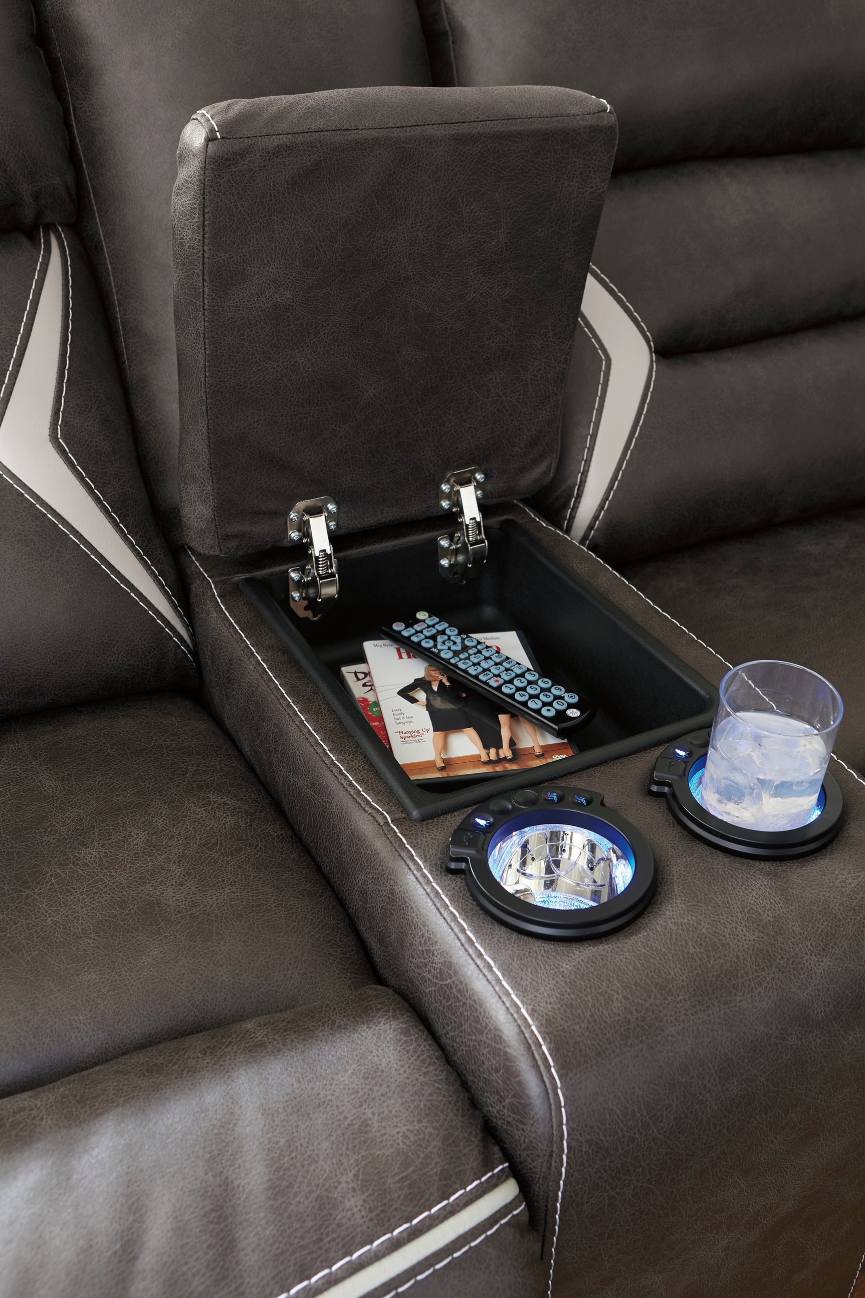 Power reclining sectional showing LED-lit cup holders and storage console