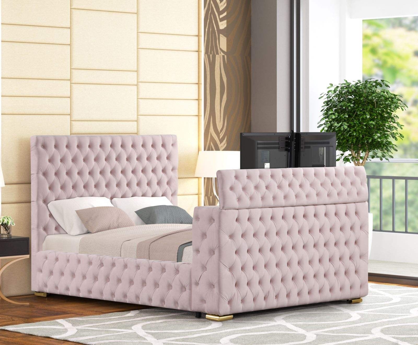 TV mounted on footboard of Future pink velvet platform bed