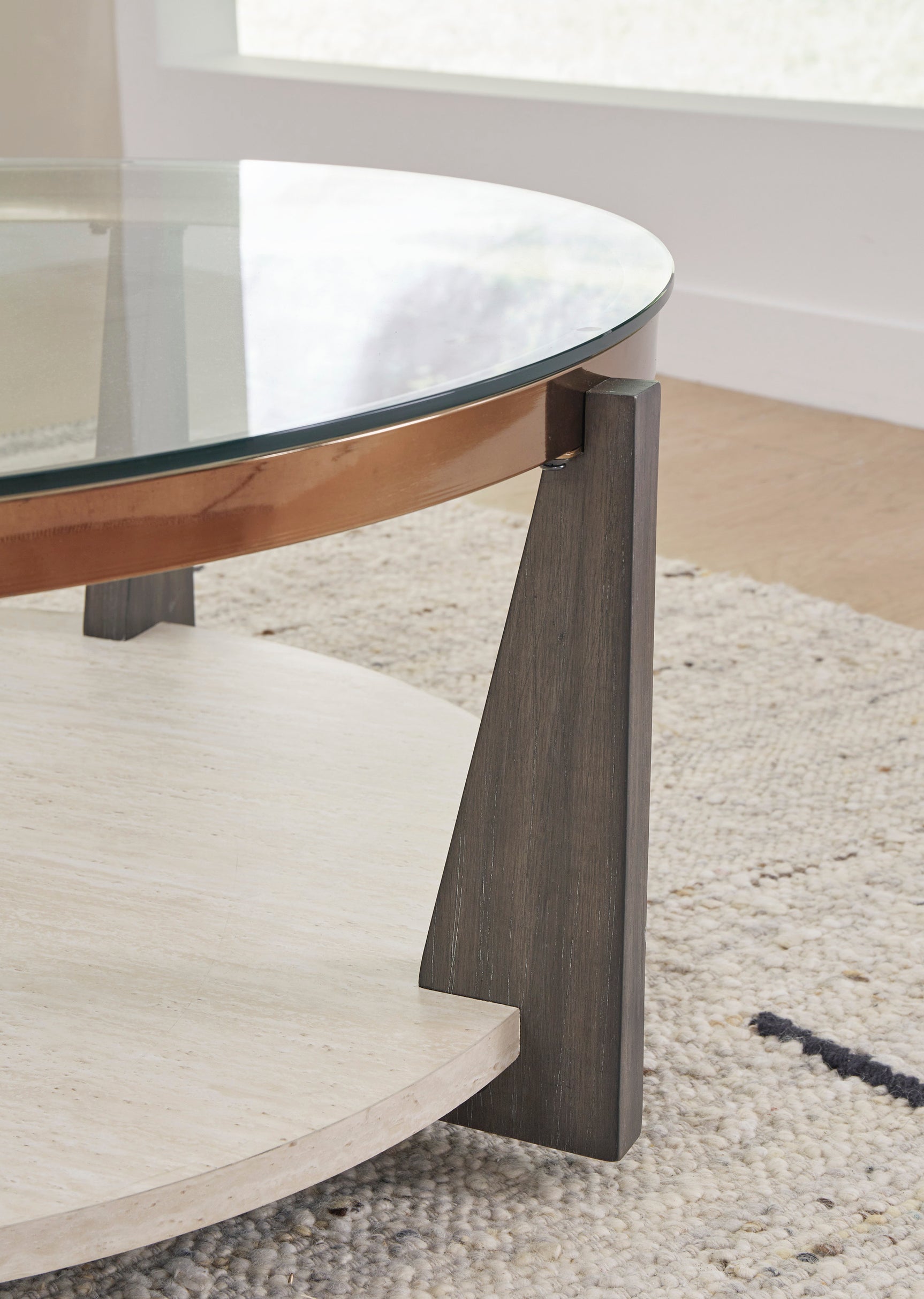 Close-up of wood-tone legs and metal frame on Frazwa Cocktail Table