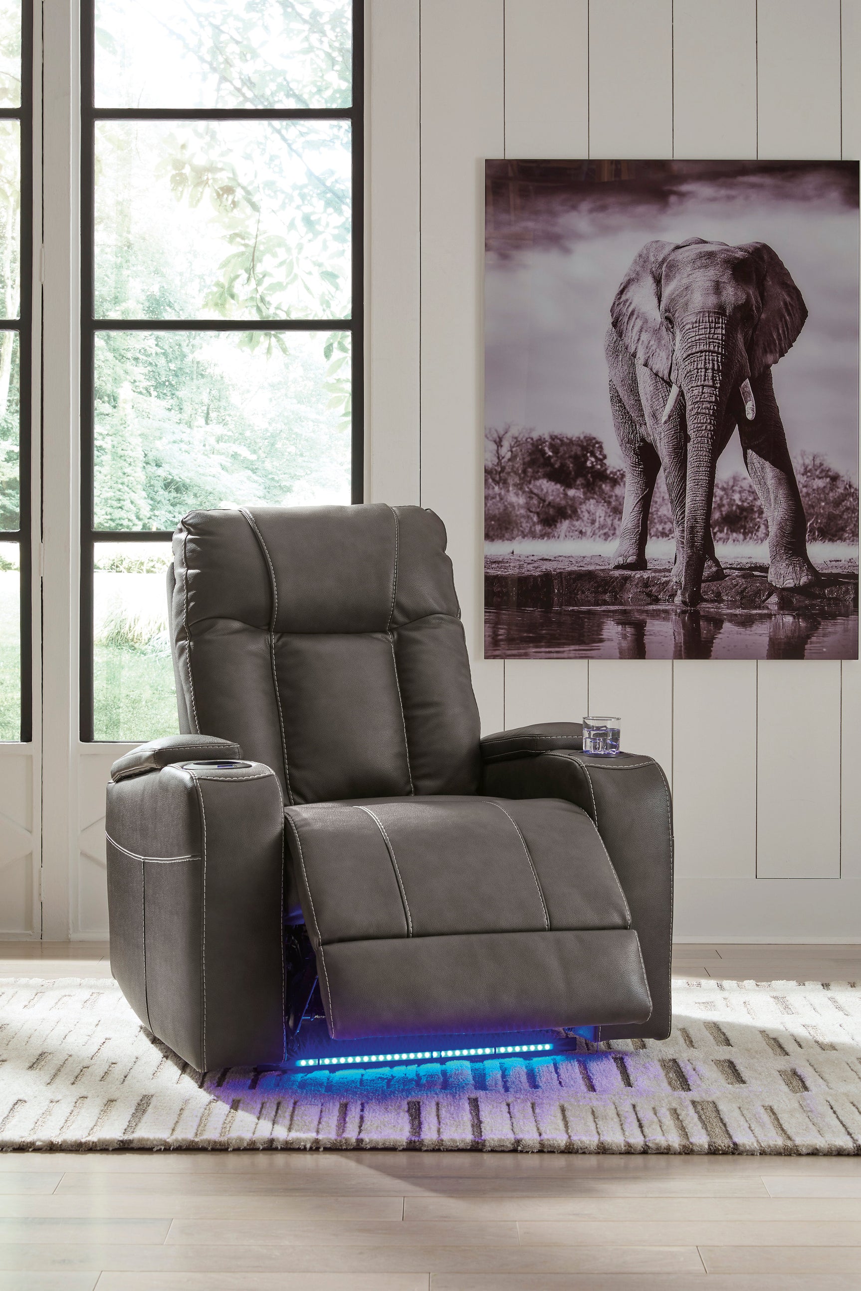 Side angle of Den gray faux leather power recliner showing armrest and USB port