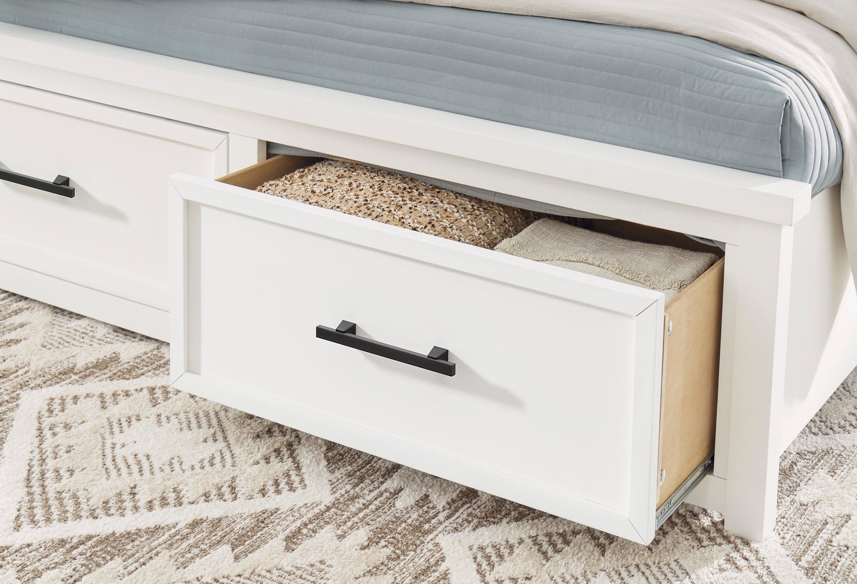 Bedroom setting with Ashbryn White Storage Platform Bedroom Set bed