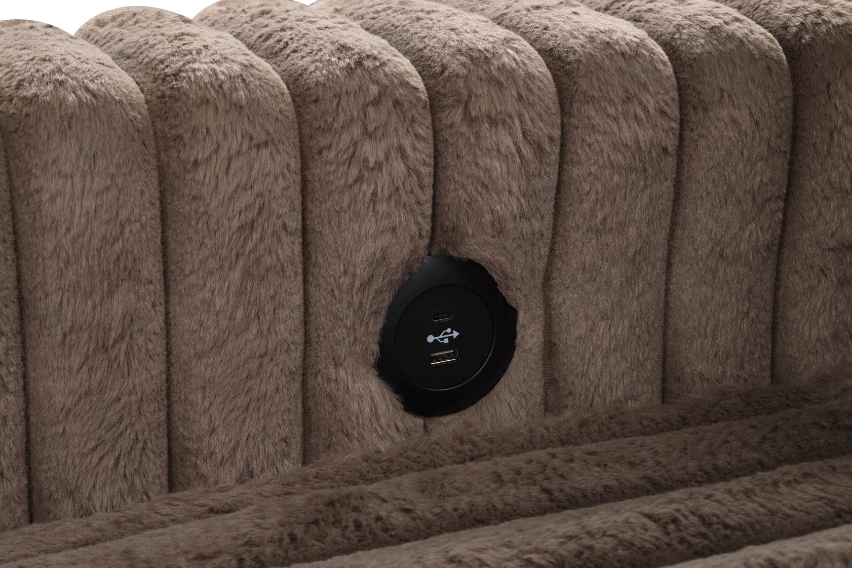 Close-up detail of mocha fabric upholstery and pull-out bed mechanism
