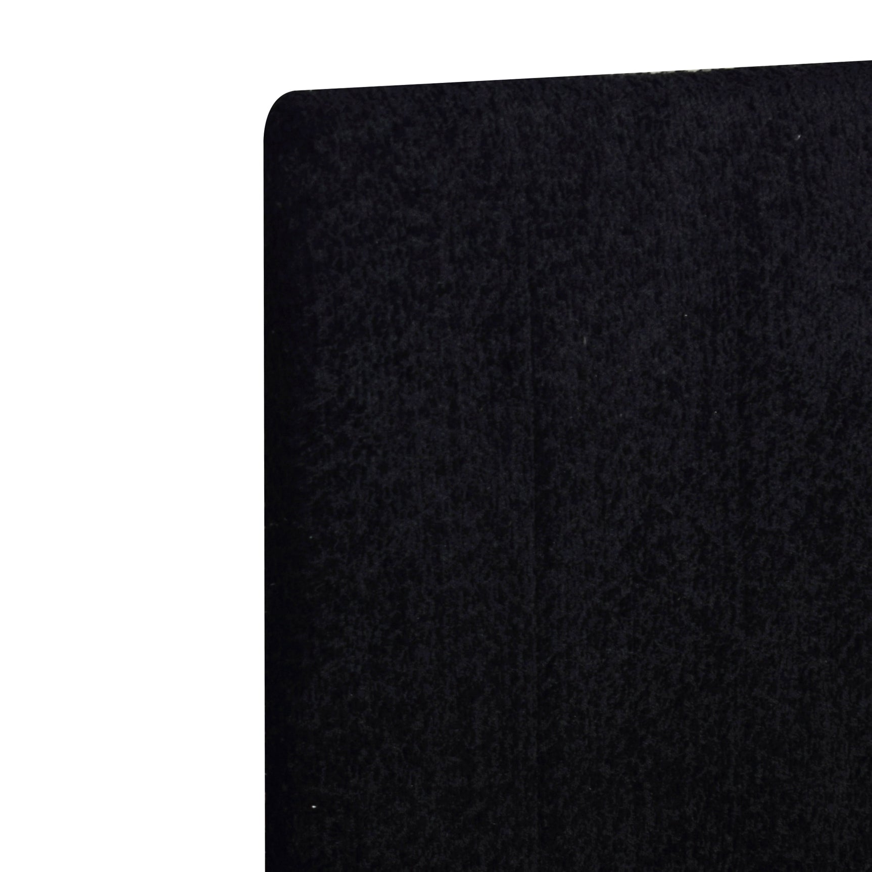 Close up of black upholstered headboard on queen platform bed