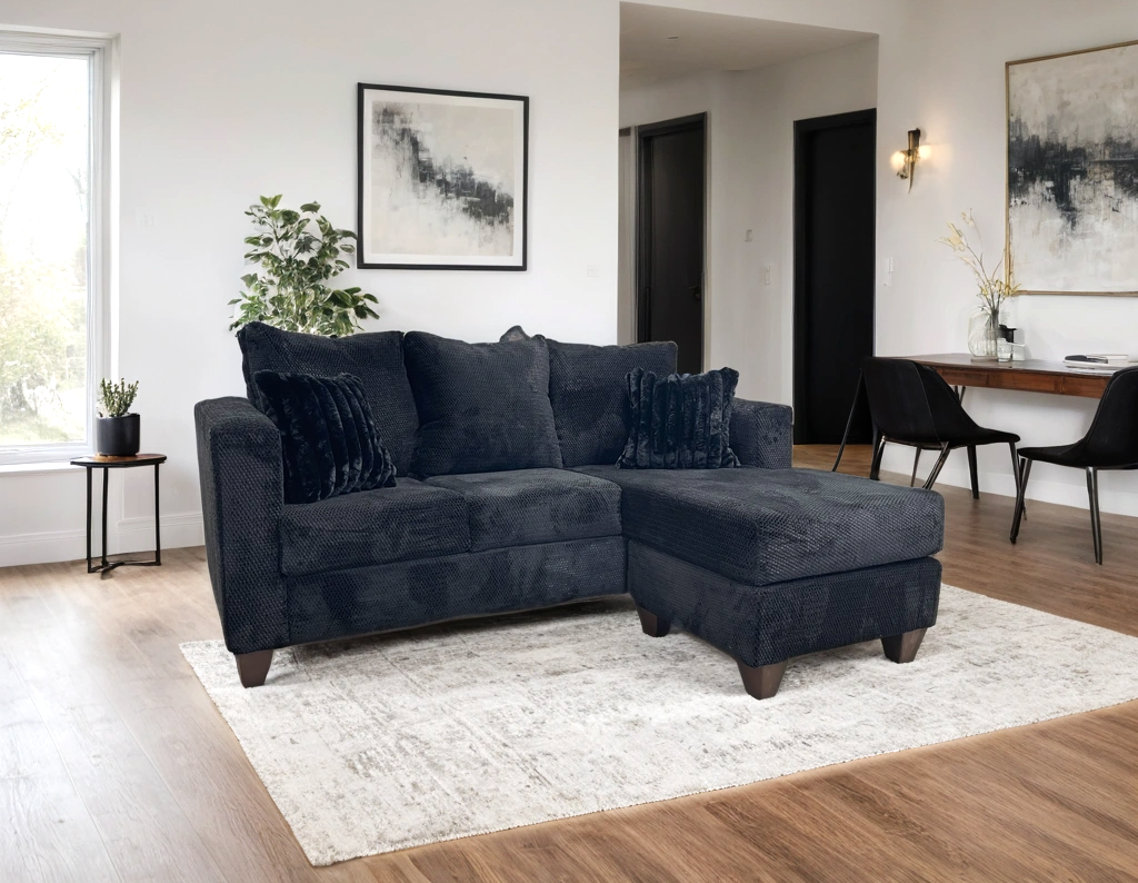 Close-up detail of black upholstery and stitching on Omni sectional