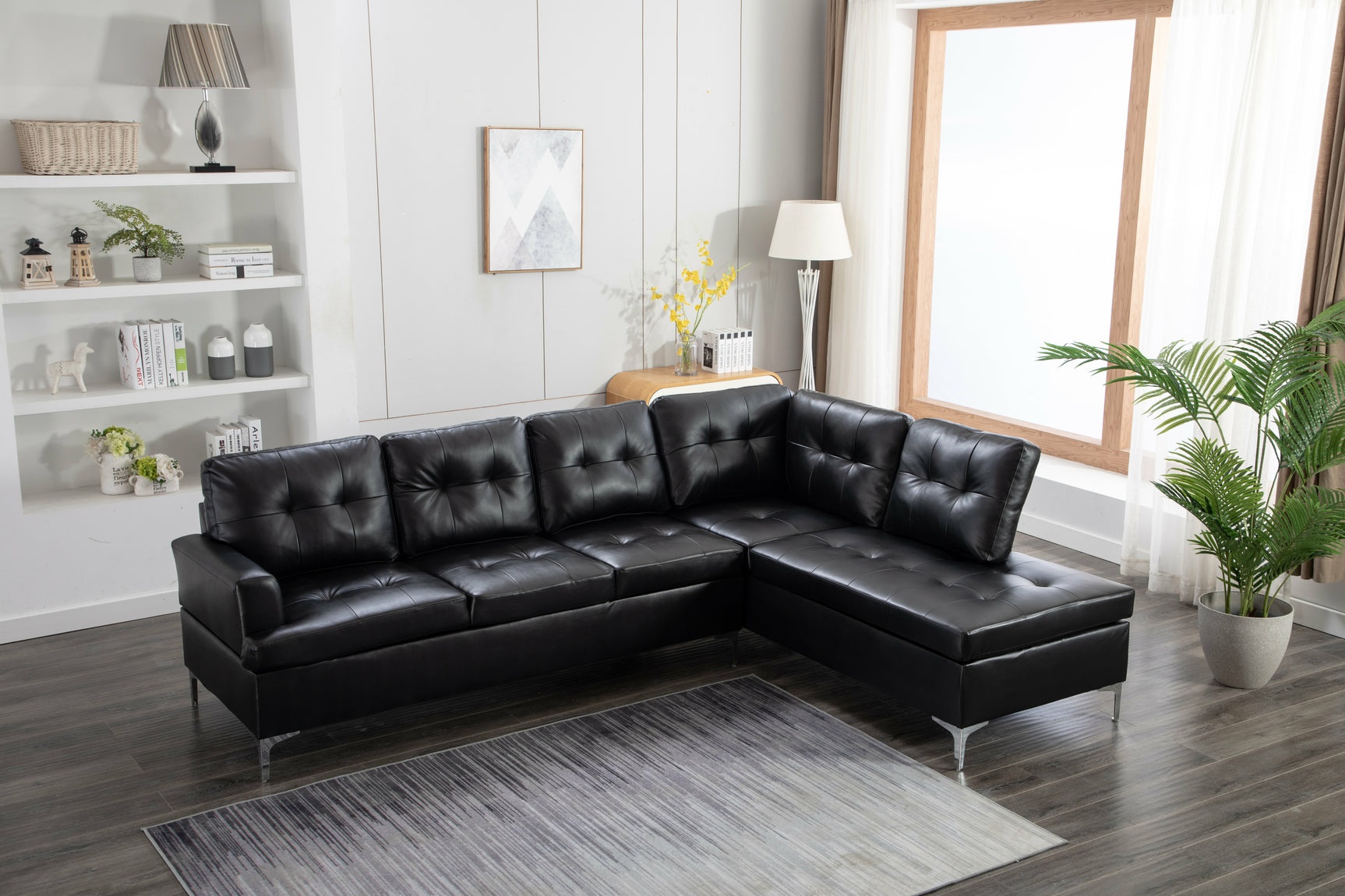 Side view of Vintage Black Faux Leather Tufted Sectional Sofa showing chaise and tufted back